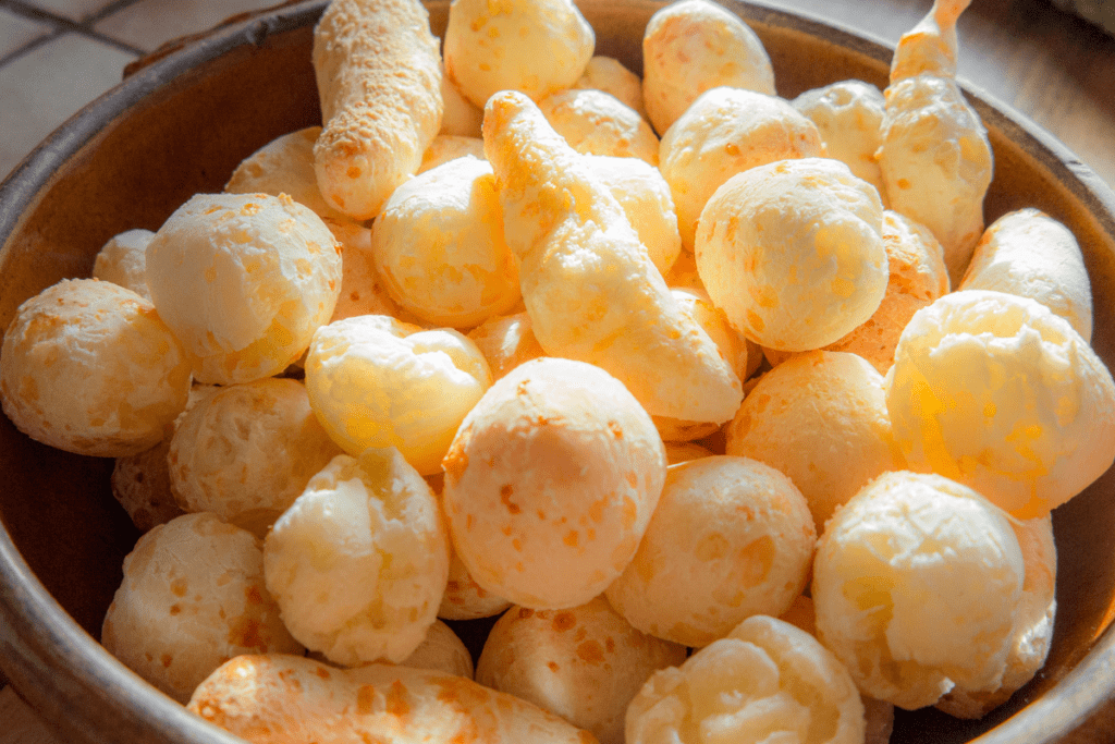 pao de queijo puffs in silver bowl