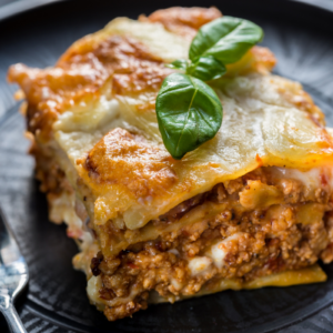 Brazilian lasagna with white sauce and layers of ham