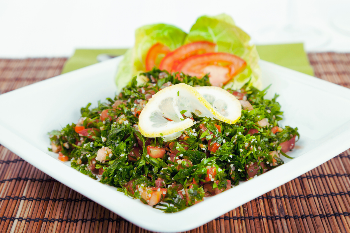 tabouleh salad with lemon garnish